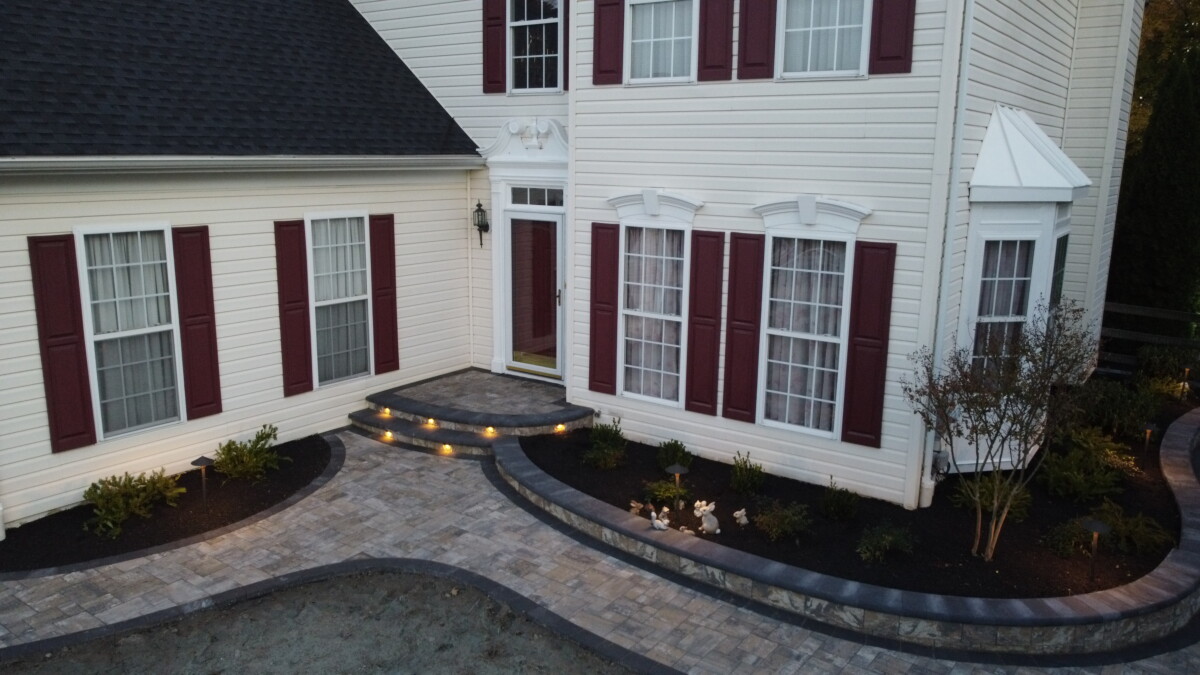 Low-voltage exterior lighting on a residential landscape after dark