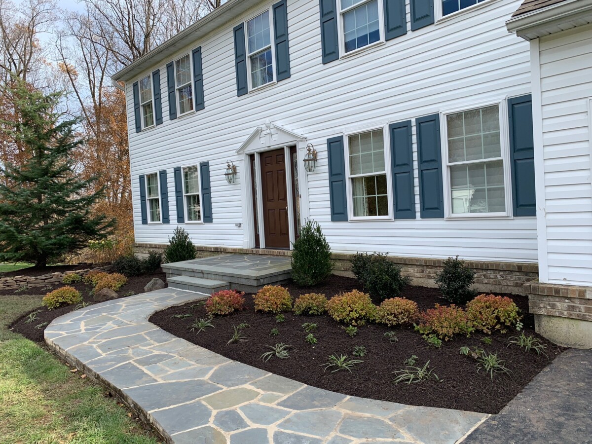 Designed residential landscape with layered planting beds