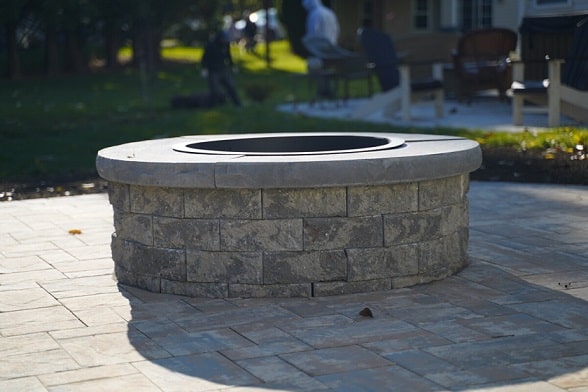 Custom stone firepit built by Green Acres in a Wilmington, DE backyard
